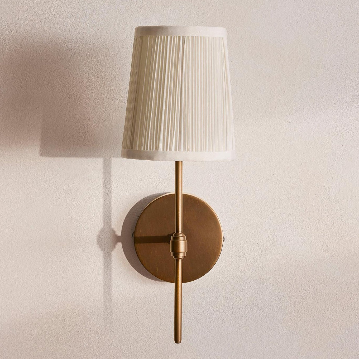 Anise Wall Light. Antiqued Brass