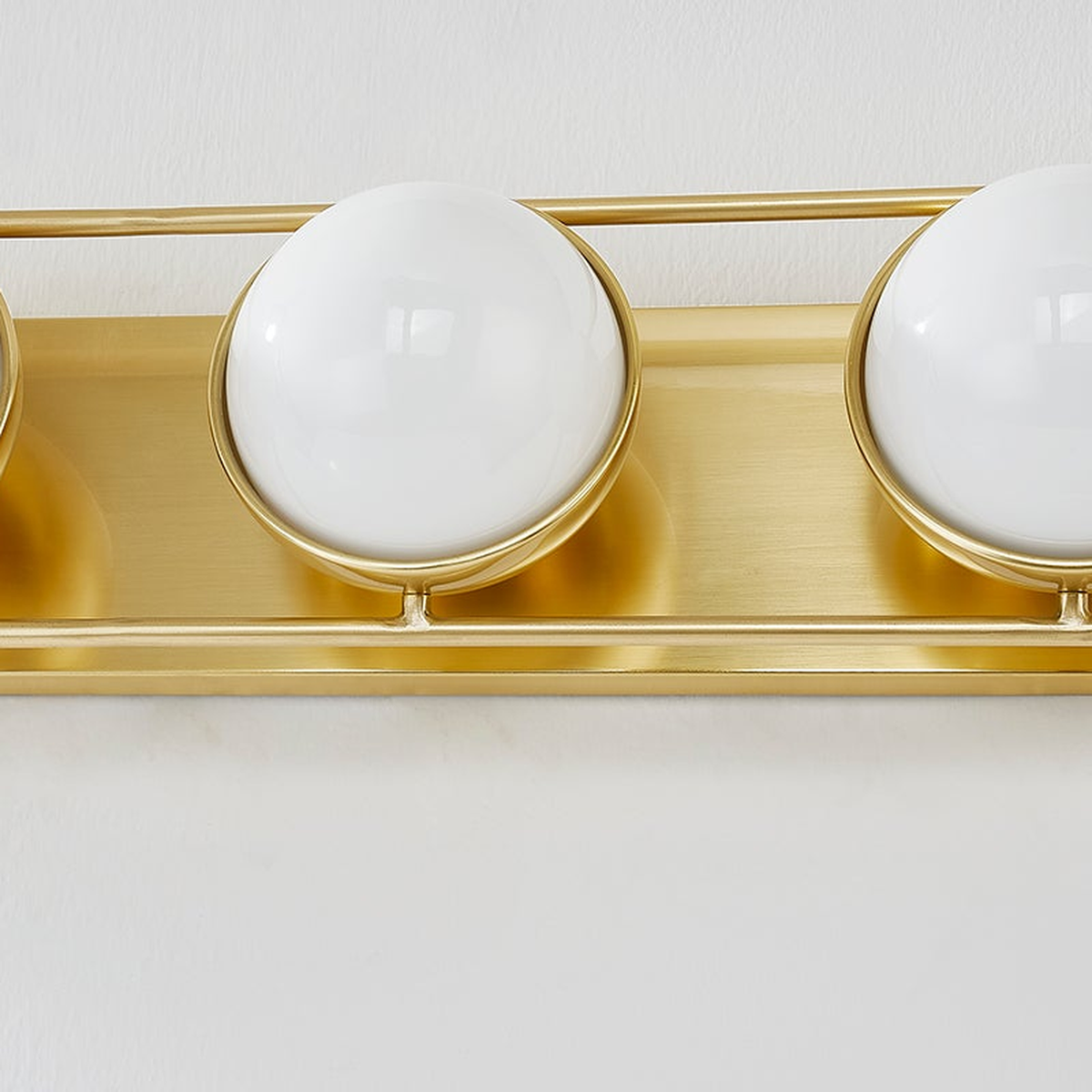 Sia Aged Brass Globe Vanity Sconce